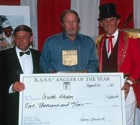 <p>
	<strong>I'll take two ... or more</strong></p>
<p>
	Roland Martin earned the most AOY titles with nine. Kevin VanDam is second with seven, including a record four in a row (2008-11). Bill Dance and Mark Davis have won three each. Guido Hibdon (pictured here flanked by former B.A.S.S. Tournament Director Dewey Kendrick, left, and B.A.S.S. founder Ray Scott, right), Davy Hite, Jimmy Houston, Gary Klein and Larry Nixon have each won twice.</p>

