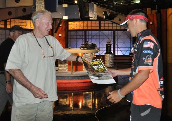 <p>
	B.A.S.S. co-owner Jerry McKinnis surprised Zack Birge of Oklahoma State University with a mock-up of the September issue of the B.A.S.S. Times cover. Birge and his teammate did not know they would be on the cover.</p>
