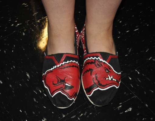 <p>
	JM Associates staff members dressed in their favorite college gear to welcome the OSU team. Some, like Gena Hatley Cole, sported spiffy Razorbacks shoes.</p>
