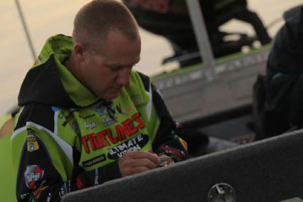 <p>
	 </p>
<p>
	Brent Chapman, current leader in the Toyota Tundra Bassmaster Angler of the Year race, ties on a bait for the start of Day One at the 2012 Ramada Championship at Oneida Lake.</p>
