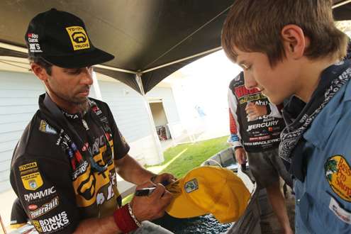 Iaconelli signs his autograph for a young fan.
