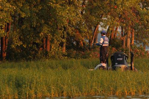 <p>
	Takahiro Omori fishes the grass at Oneida Lake.</p>
