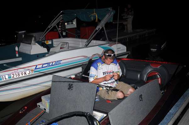 Indiana angler Larry Paul gets his tackle ready before takeoff.
