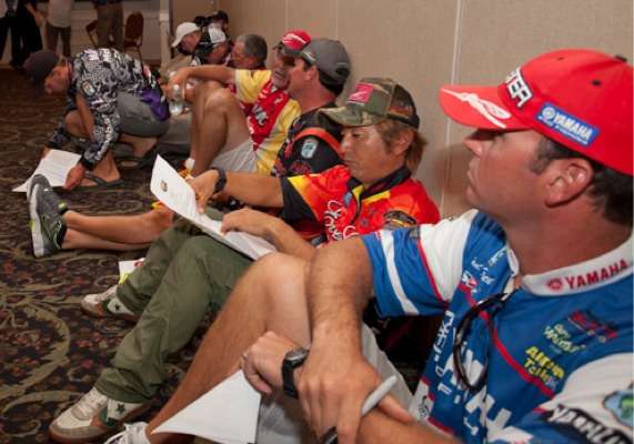 <p>
	Elite Series angler Morizo Shimizu looks over  his paperwork. It's a packed house for the briefing!</p>
