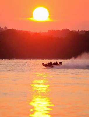 The sun begins to rise on Cayuga as the last boats speed away to begin Day One. 