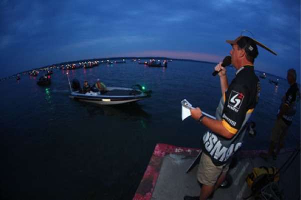 <p>
	Tournament Director Chris Bowes calls the order for Day Two as boats pass through inspection.</p>
