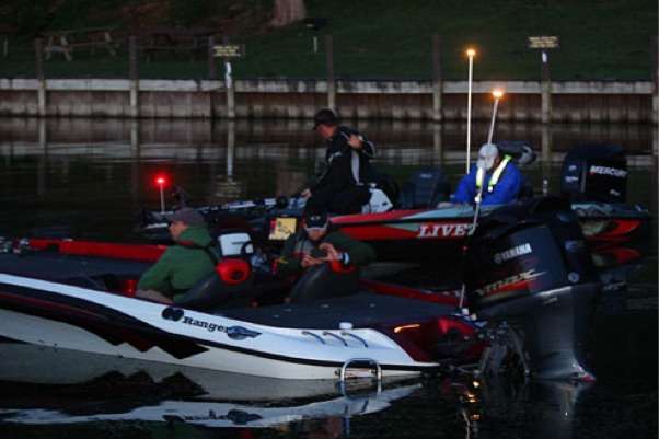 <p>
	Anglers make last minute adjustments and secure their gear while waiting for the official start.</p>
