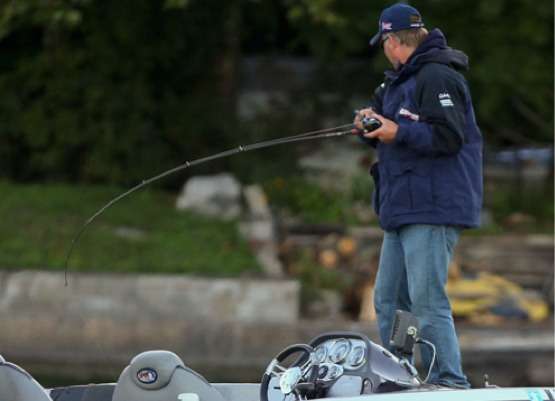 <p>
	Gluszek sets the hook and gets in on the fish catching action. </p>
