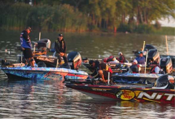 <p>
	Kevin VanDam adjusts his electronics early in the morning for the day ahead on Oneida Lake.</p>
