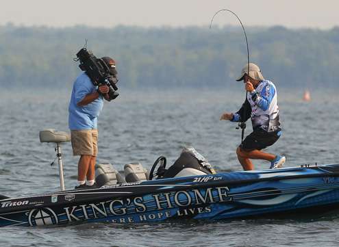 <p>
	Howell moves to remove the hooks from his first keeper of the day.</p>
