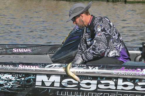 <p>
	Aaron Martens throws back one of several non-keepers caught Thursday.</p>
