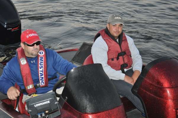 Eric Femiak of Massachusetts and Jesus Santos of Spain head through the boat check line.