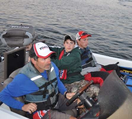 Lucas Micael Cadieux opens the livewell for boat check, and his partner, Benjamin Seaman, listens to instructions. The pair are fishing the Junior Bassmaster division for Vermont.
