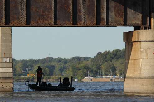 <p>
	Aaron Martens fishes around bridge piles.</p>

