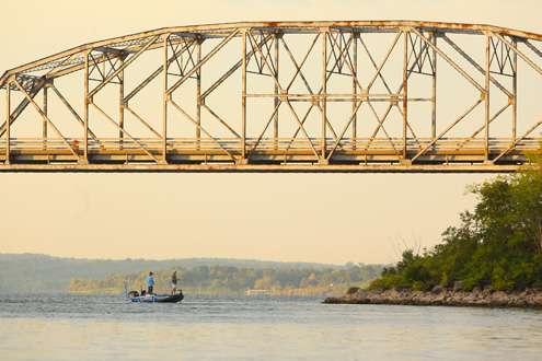 Jared Miller starts the morning fishing near a Fort Gibson Lake bridge. 