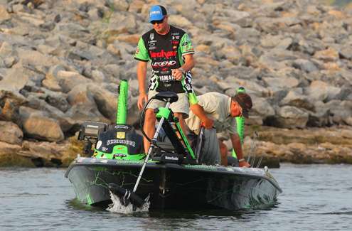 After failing to connect on a riprap wall, Scott Ashmore pulls his trolling motor from the water to make a move. 