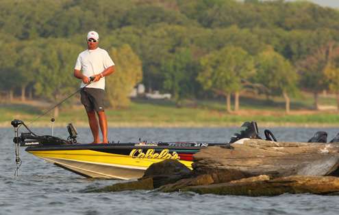 Elite Series angler Jeff Kriet fishes a steep rocky point. 
