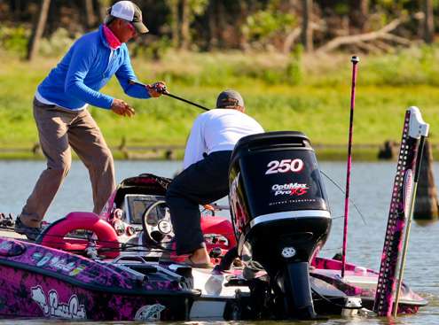 The crankbait pattern in the stumps begins to pay off, as Glasby moves to net a fish for Short.  