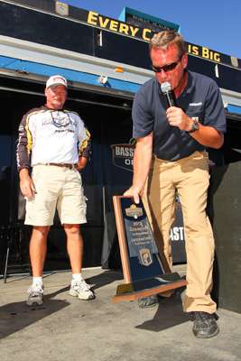 <p>
	Joe Lane waits to receive the co-angler trophy from B.A.S.S. Senior Tournament Director, Chris Bowes. </p>
