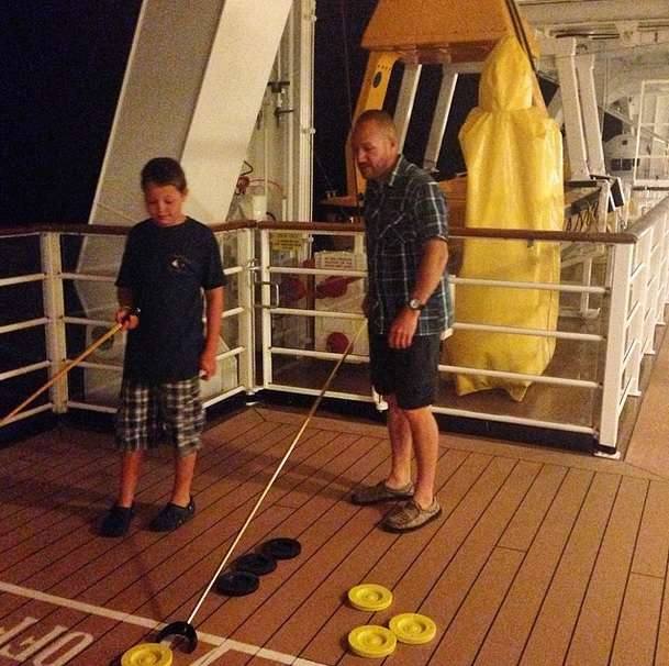 The Chapmans also took to the sea, playing a relaxing game of shuffleboard on deck. 