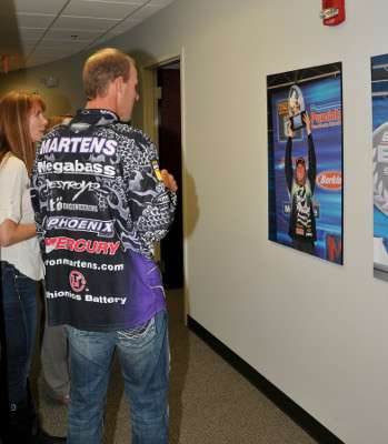 <p>When Martens sees a poster up in the B.A.S.S. hallway of his 2007 win on the California Delta, he pulls out a pen to autograph it.</p>
