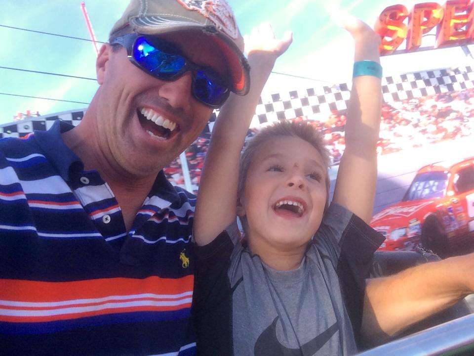 Edwin Evers enjoys a ride with his son Kade at the Tulsa state fair.