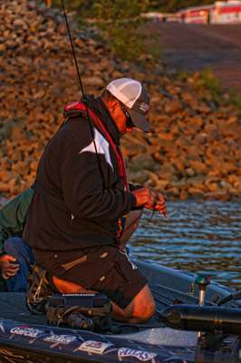 <p>Chris Lane makes last minute preparations to his fishing tackle.</p> 