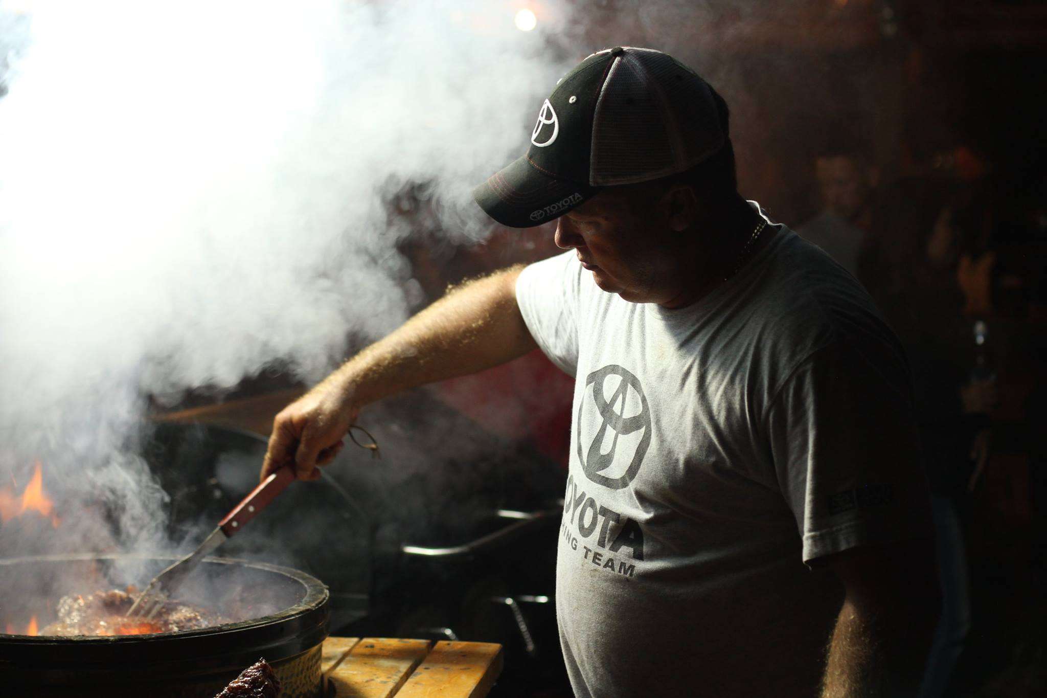 Terry Scroggins cooks up some big ol' steaks at the Toyota USA Owners Event on Kentucky Lake.