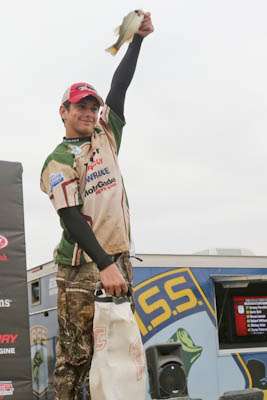 <p>Christopher Chandler holds up a keeper to start off the 2012 Bassmaster Junior World Championship weigh-in.</p> 