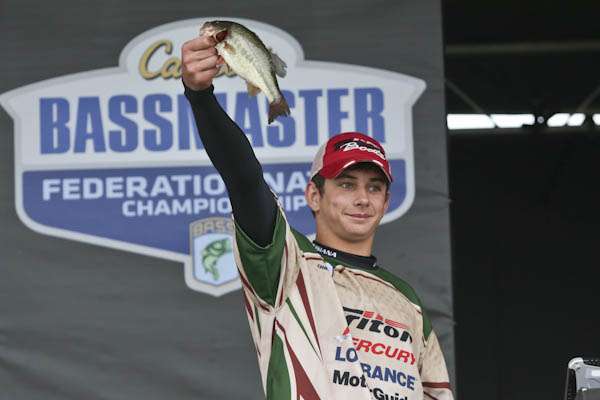 <p>Chandler weighs his 1 lb bass to become the first leader in the 15 to 18 age group.</p> 