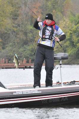 <p>Taylor lifts a largemouth out of the water.</p>
