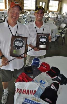 Robert Williamson, fishing for New Hampshire, and Jonathan Carter of Maine show off the gifts they received as contenders. Each received a plaque, seven caps, two T-shirts, two hand towels, a boat flag, a skull cap and a Skeeter rod by Kistler Rods.