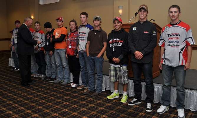 <p>All the contenders in the 2012 Bassmaster Junior World Championship stand at the banquet while the families and adult contenders cheer for them.</p> 