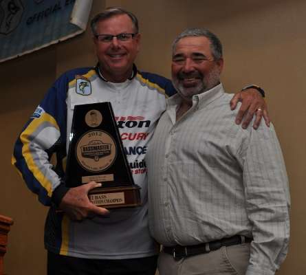 <p>Mark Dove, winner of the 2012 Cabela's Bassmaster Federation Nation Championship, accepts congratulations from Horton, defending champ.</p> 