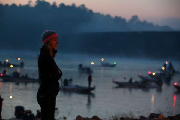 <p>This woman watches the launch as the sun rises. </p>
