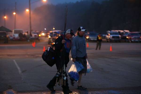 <p>These anglers carry their gear over to the dock. </p>
