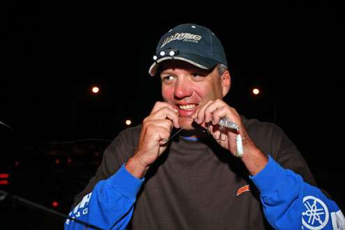 <p>Brent Crow tightens up the knot on a jerkbait heâll use today on Smith Lake.</p> 