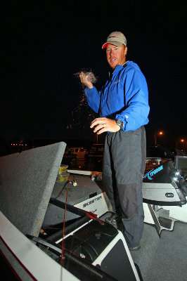<p>Greg Vinson strips line from a reel to get it ready for a new day on Smith Lake.</p> 