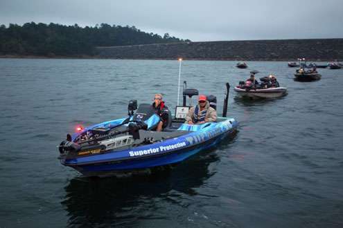 <p>Kevin Hawk passes through the safety check line one last time on Smith Lake.</p> 