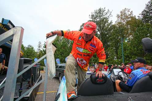 <p>Co-angler Jay Ramey pulls his fish from the live well. </p> 