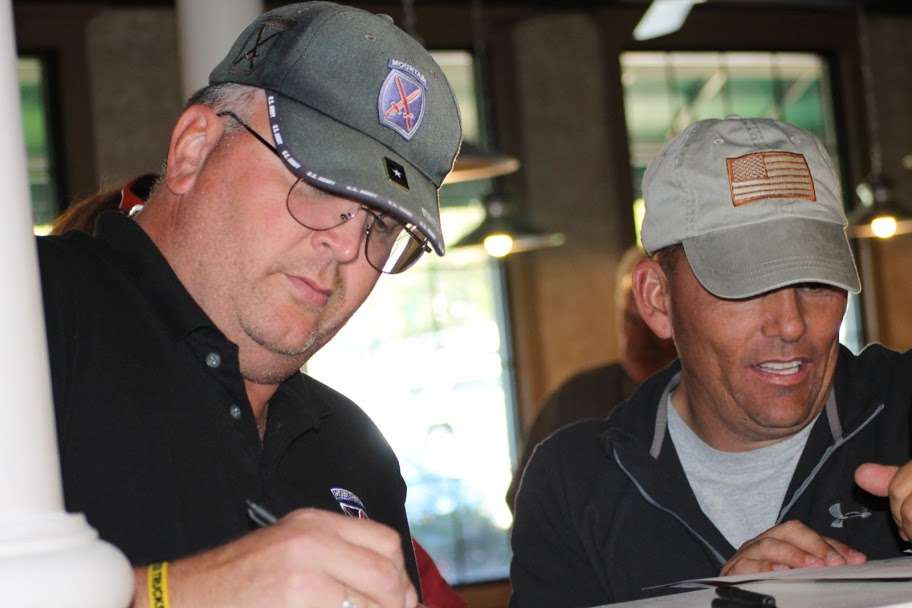 <p>David Converse Lt. Col. (ret) 10th Mountain Division on the left, Dave Campbell 1st Sgt (ret) 10th Mountain Division on the right, signing in for the tournament<wbr>.</wbr></p>

