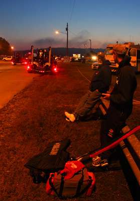 <p>Co-anglers wait along a guard rail to meet the pros they will fish with on Day One.</p> 