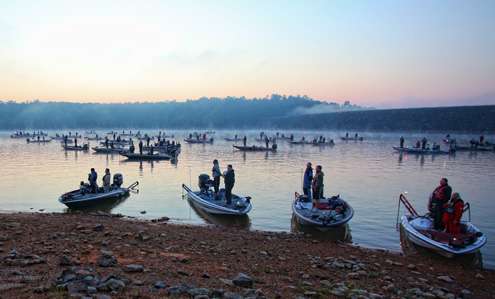 <p>Anglers stand in their boats as the national anthem is played.</p> 