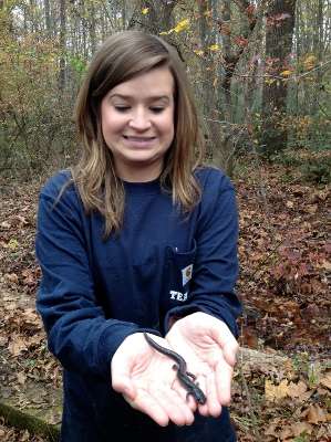 <p>Helen Northcutt holds a salamander that crawled out from an area where she had pulled weeds. When we posted this photo on Twitter, our followers were happy to proclaim this was good fish bait.</p>
