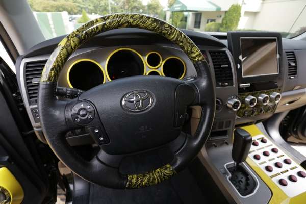 <p>Inside, the cab is trimmed with a sporty yellow on the dash and console.</p>

