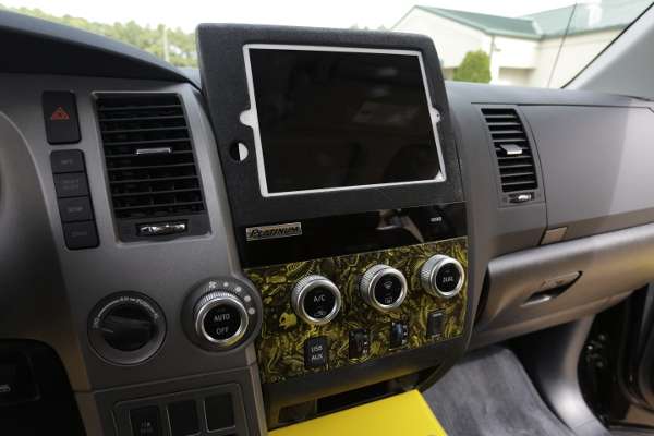 <p>A TV monitor is installed in the console, and an angler can watch fishing videos and view Navionics maps on it.</p>
