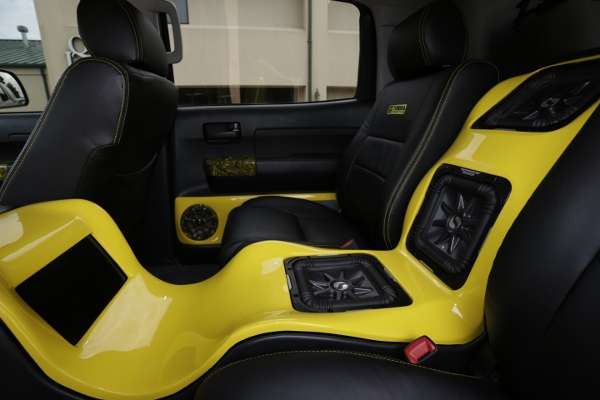 <p>Myers replaced the rear bench with bucket seats and custom-built a fiberglass console that stretches from the dash to the rear cab wall with built-in video monitors and subwoofers.</p>
