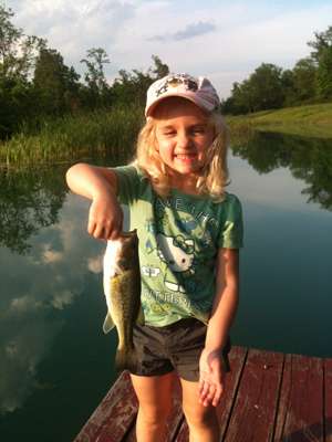 <p>
	Ali, 5, may want to save the butterflies, but sheâs all about catching the bass! This one was her first.</p>

