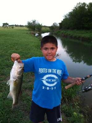 <p>
	This bass came out of the creek at this young fishermanâs home; what a great way to grow up, with fish right on your property!</p>
