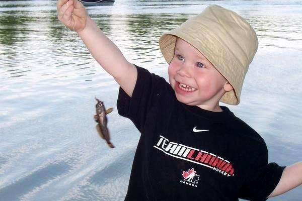<p>
	Young Lucas is thrilled to be fishing with his mom!</p>
